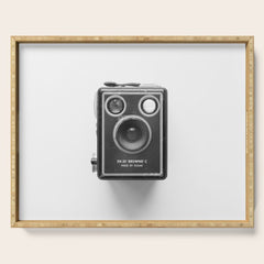 A Kodak Brownie analog vintage camera on a white background Retro photography in black and white Serving Tray