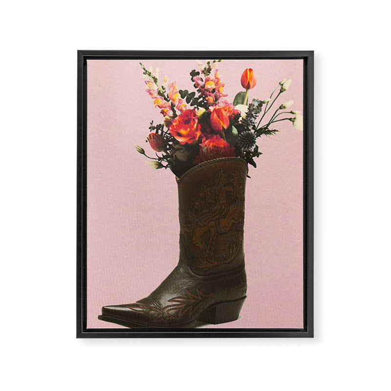 A Cowboy Boot With Spring Bouquet Framed Canvas Print