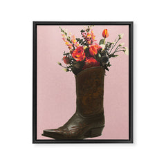 A Cowboy Boot With Spring Bouquet Framed Canvas Print