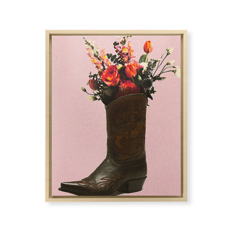 A Cowboy Boot With Spring Bouquet Framed Canvas Print