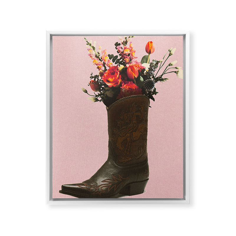 A Cowboy Boot With Spring Bouquet Framed Canvas Print