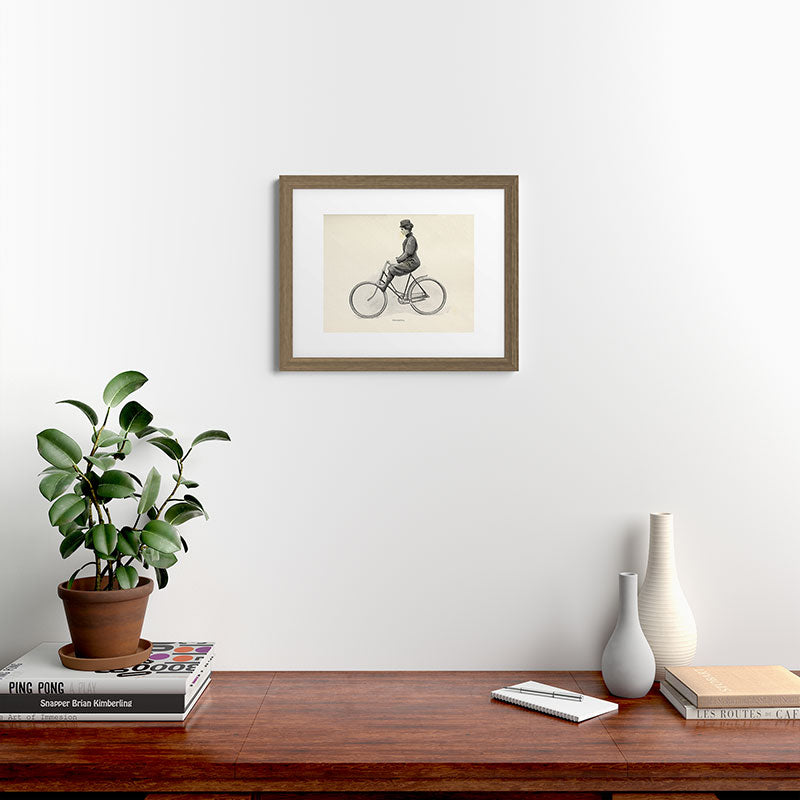 "Coasting" from "Bicycling for Ladies" by Maria E. Ward, 1896 Framed Art Print